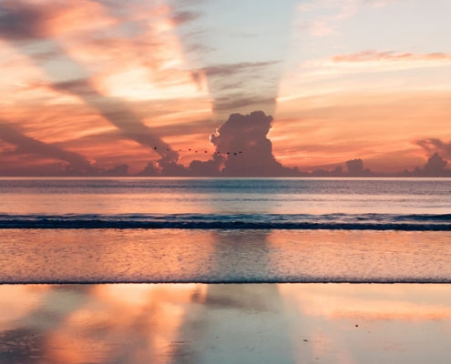 Mer et rayons de soleil - Photo par Ravi Pinisetti (unsplash.com)
